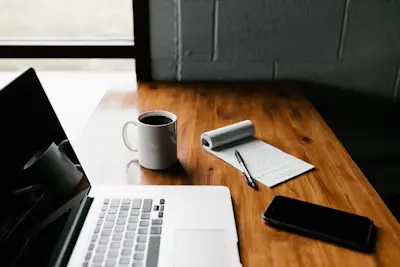 Notebook and coffee — the work of storytelling